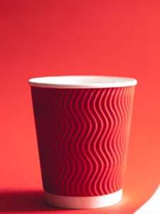 Disposable paper cup in trendy color Viva Magenta.
